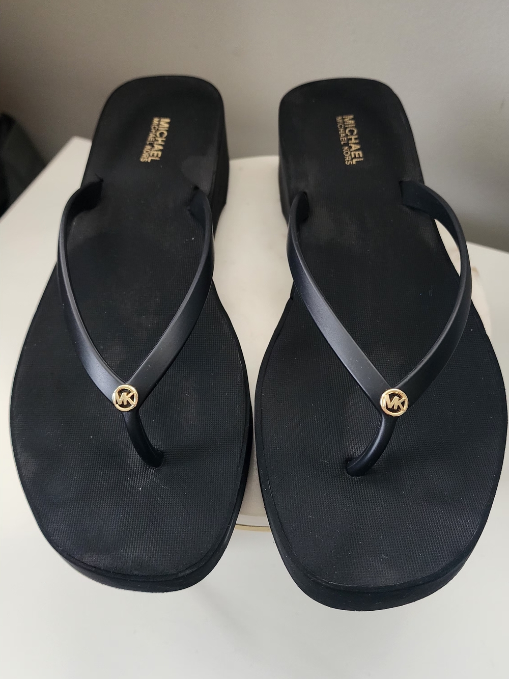 Michael Kors Black Flip Flop Sandals with Gold MK Medallion
